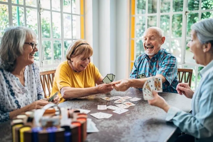 Seniors-enjoying-a-card-game-in-a-senior-living-community-recommended-by-a-senior-care-advisor-1.jpg