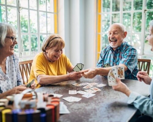 Seniors-enjoying-a-card-game-in-a-senior-living-community-recommended-by-a-senior-care-advisor-1.jpg