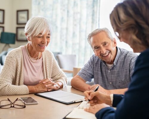 senior placement advisor assisting a senior couple with senior care options